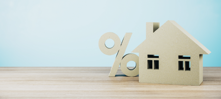 Percentage sign and Model House on blue background